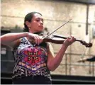  ??  ?? Violinist Natalia Cascante and aerialist Glenna Broderick rehearse to Massenet’s ‘Meditation.’