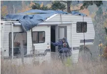  ?? CHARLOTTE HELSTON/ INFONEWS.CA ?? Police officers at a rural property on Salmon River Road. Human remains were found on the property as police were executing a search warrant.