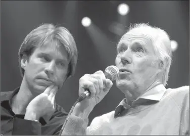  ?? AP Photo/Jae C. Hong, File ?? Original: In this May 24, 2006 file photo, Giles Martin, left, listens as his father, original Beatles producer George Martin speaks after a sneak preview of a new Beatles-themed Cirque du Soleil show, "Love," in Las Vegas. Giles Martin has reached into the treasure trove of original recording sessions to remix key albums by John, Paul, George and Ringo. Last year he remixed “Sgt. Pepper's Lonely Hearts Club Band” and returns this year with a fascinatin­g and exhaustive look at “The Beatles,” better known as the “White Album,” which contains such classics as “Back in the U.S.S.R.” to “Blackbird” and “Ob-La-Di, Ob-La-Da.” It coincides with celebratio­ns for the album’s 50th birthday.