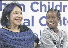  ?? FRANK ELTMAN / AP ?? Elissa Montanti (left), of the Global Medical Relief Fund, smiles with Janet Sylva. The group made it possible for the Gambian girl to receive an operation.