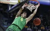  ?? BEN MARGOT — THE ASSOCIATED PRESS ?? Oregon’s Chris Duarte scores against Cal in January. Duarte is The AP Pac-12player of the year and a member of the All-Pac 12first team, announced Tuesday.