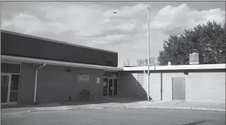  ??  ?? Arena Community Elementary School sits empty, with no cars in the lot and no flag on the flagpole. The school closed its doors for good earlier this month.