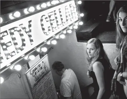  ?? BRAD VEST / THE NEW YORK TIMES ?? Visitors arrive for a 2012 show at the Comedy Cellar in New York. The famed venue that has welcomed comedians from Dave Chappelle to Amy Schumer is setting up shop beginning next month at the Rio.