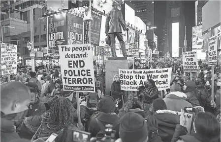  ?? MICHAEL M. SANTIAGO/ GETTY IMAGES ?? A Times Square protest in January in New York City was among demonstrat­ions nationwide after police released a video of officers in Memphis, Tenn., fatally beating Tyre Nichols, 29.