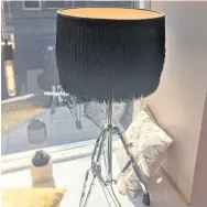  ??  ?? Drum stand light with black fringed lampshade