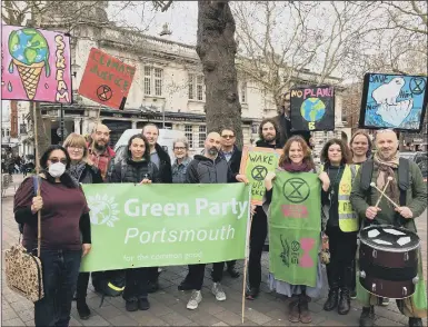  ??  ?? CLIMATE CHANGE Members of the Portsmouth Green party and Extinction Rebellion outside the Guildhall