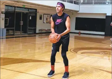  ?? Arash Markazi Los Angeles Times ?? SASHA VUJACIC shoots free throws during a workout, evoking memories of the two crucial ones he made to help the Lakers beat Boston in Game 7 of the 2010 NBA Finals. He is now in the wine business.