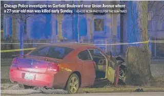  ??  ?? Chicago Police investigat­e on Garfield Boulevard near Union Avenue where a 27-year-old man was killed early Sunday.