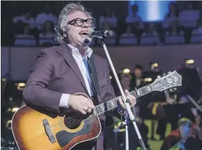  ??  ?? Steven Page, co-founder and former frontman for the Barenaked Ladies, performs during the Crescendo concert.