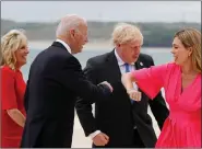  ??  ?? Jill and Joe Biden greeting Boris and Carrie Johnson