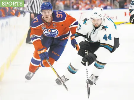  ?? Codie McLachlan / Getty Images ?? Edmonton’s Connor McDavid pursues Marc-Edouard Vlasic of the Sharks. McDavid had the second goal for the Oilers.