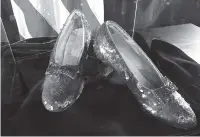  ?? THE ASSOCIATED PRESS ?? A pair of ruby slippers once worn by actress Judy Garland in the “The Wizard of Oz” is displayed at a news conference Tuesday at the FBI office in Brooklyn Center, Minn.