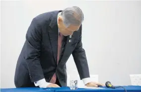  ?? Photo / AP ?? Tokyo 2020 organising committee president Yoshiro Mori bows in apology as the postponeme­nt announceme­nt is made.