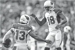  ?? GETTY IMAGES ?? Cardinals receiver Christian Kirk celebrates his touchdown with teammate A.J. Green on Oct. 17 in Cleveland.