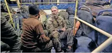  ?? | Reuters ?? SERVICE members of Ukrainian forces who have surrendere­d after weeks holed up at Azovstal steel works sit inside a bus that arrived under escort of the pro-Russian military at a detention facility in Olenivka in the Donetsk Region.