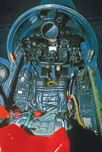  ?? (Photo by Ted Carlson/fotodynami­cs.net) ?? The U-2 pilot’s office shows the periscope viewer (the large, round optical window). This U-2 has some “glasscockp­it” displays added into the older analog U-2R cockpit. The ejection seat is noteworthy. The cockpit is similar to that flown by the author. Note the small standby attitude indicator and mag compass on the left side of the instrument panel. All USAF U-2s are now upgraded with all-glass cockpits.