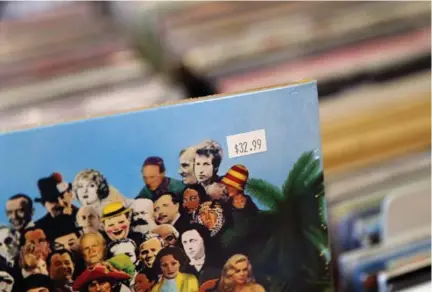  ?? RENÉ JOHNSTON/TORONTO STAR ?? The price of the Beatles’ Sgt. Pepper’s says it all. Critics wonder where soaring prices will end as vinyl records continue their comeback.