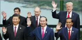  ?? JORGE SILVA — POOL PHOTO VIA AP ?? Leaders pose during the family photo session at the APEC Summit in Danang, Vietnam, Saturday.