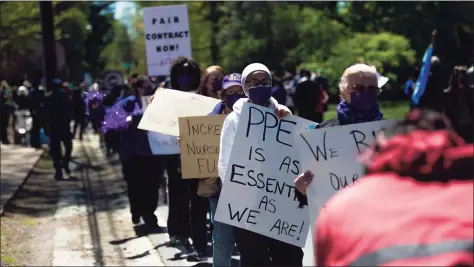  ?? Kassi Jackson / Associated Press ?? Hundreds of protesters joined elected officials out front of the Governor's Mansion on Saturday in Hartford, calling on Gov. Ned Lamont to take action toward a more equitable state budget. The protesters are hoping to draw attention to the Democrat’s proposed two-year budget, which they say falls far short of the massive financial investment needed to make Connecticu­t more equitable.