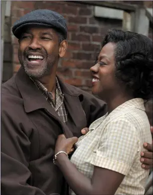  ??  ?? Denzel Washington as Troy Maxson and Viola Davis as Rose Maxson in Fences.