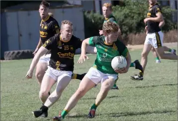  ??  ?? Donal Shanley of St. Fintan’s battles with Adamstown’s Michael Boland.