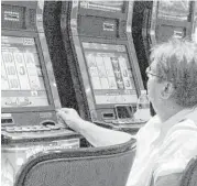  ?? Wayne Parry / Associated Press ?? A gambler plays slot machines at the Golden Nugget casino in Atlantic City, N.J.