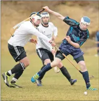  ?? Photograph: Neil Paterson. ?? Lovat’s Danny Kelly and Skye’s Connor Gilpin battle for the ball during last Saturday’s game at Pairc nan Laoch.