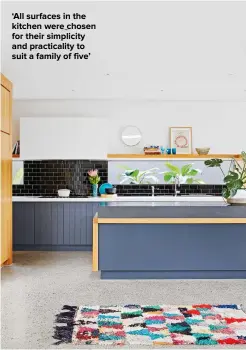  ??  ?? ‘ALL SURFACES IN THE KITCHEN WERE CHOSEN FOR THEIR SIMPLICITY AND PRACTICALI­TY TO SUIT A FAMILY OF FIVE’