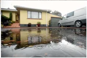  ??  ?? Raewyn James has been left feeling frustrated by ongoing flooding issues at her Browne Street, Waitara, home.