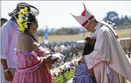  ?? ALESSANDRA TARANTINO / ASSOCIATED PRESS ?? A child embraces Pope Francis during a Mass on Wednesday at the Maquehue air base in Temuco, Chile. About 150,000 people attended.