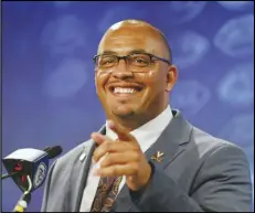  ?? Associated Press ?? Virginia head coach Tony Elliott laughs as he answers a question at the NCAA college football Atlantic Coast Conference Media Days, Thursday, in Charlotte, N.C.