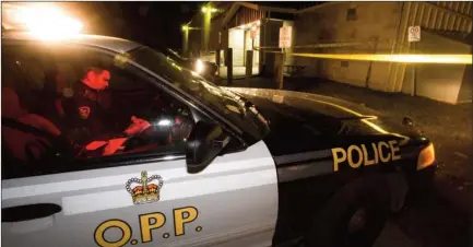  ?? JASON BAIN QMI Agency ?? A City of Kawartha Lakes OPP officer is seen parked in front of the Woodville/Eldon Community Centre after a seriously injured child was found in a ditch on Oct. 18, 2010. The five-year-old girl and the OPP officers who investigat­ed the assault were...