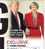  ??  ?? CLOSE PM holds hands with Trump