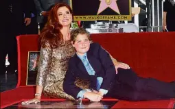  ??  ?? United States: Actress Debra Messing posing with her son Roman Walker Zelman on her Hollywood Walk of Fame Star during a ceremony in Hollywood, California. Messing became the recipient of the 2,620th star in the television category. — AFP