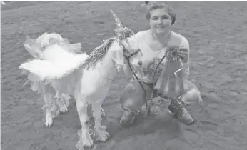  ?? CITIZEN PHOTO BY CHRISTINE HINZMANN ?? Kaila Vanleeuwen, 14, and Prince Uni-goat took top prize in the Dress Up contest held for the 4-H children at the Agriplex on Sunday during the annual BC Northern Exhibition.