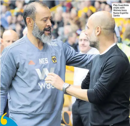  ??  ?? Pep Guardiola chats with Wolves boss Nuno Espirito Santo