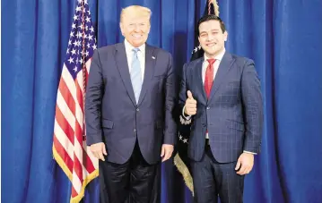  ?? DOUGLAS COULTER ?? Donald Trump poses with Kevin Cabrera when Cabrera was director of the then-president’s 2020 Florida campaign. On Wednesday, Trump endorsed Cabrera’s bid to be vice chair of the Florida Republican Party.