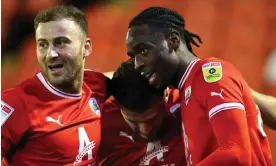  ?? Robbie Jay Barratt/AMA/Getty Images ?? Devante Cole (right) celebrates Barnsley’s first goal against Sheffield Wednesday. Photograph: