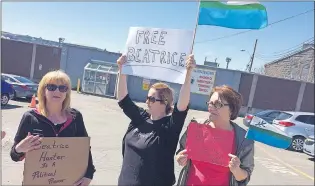  ?? JOE GIBBONS/THE TELEGRAM ?? Brenda Green (from left), Jodi Greenleave­s and Anne Hamel, protest outside Her Majesty’s Penitentia­ry in St. John’s Friday calling for the release Beatrice Hunter of Hopedale, a member of the Labrador Land Protectors.