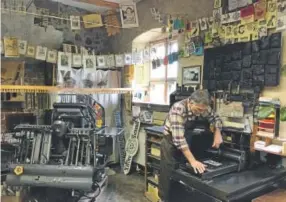  ?? Photos by Eliot Stein, Special to The Washington Post ?? Andreas Metschke operates a historical print shop in Wittenberg, one of the last such in the area.