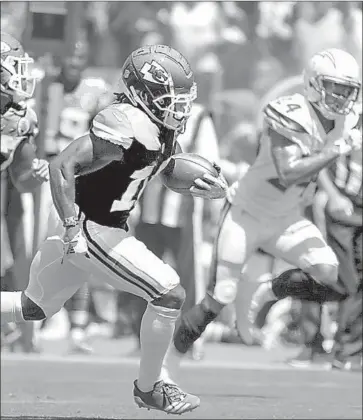  ?? Robert Gauthier Los Angeles Times ?? CHIEFS WIDE RECEIVER Tyreek Hill streaks past Chargers defenders during a 58-yard touchdown catch in the teams’ first meeting this season, the Sept. 9 opener won by Kansas City 38-28.