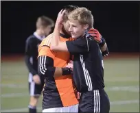  ?? AUSTIN HERTZOG - MEDIANEWS GROUP ?? Boyertown senior Matt Kerr, who scored the game-tying goal, gets a hug from goalkeeper Mason Kurtz after the Bears’ 4-3win over Whitehall in a PIAA 4A first round game Tuesday.