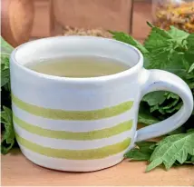  ??  ?? Nettle tea – a fertiliser made from soaking stinging nettles in water – will benefit your garden. You might prefer to sip a regular brew as you admire your work.