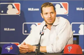  ?? John Raoux / Associated Press ?? Roy Halladay answers questions after announcing his retirement in 2013 after 16 seasons in the major leagues at the MLB winter meetings in Lake Buena Vista, Fla.