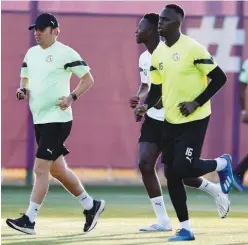  ?? Agence France-presse ?? Senegal’s players attend a practice session on Monday, on the eve of their match against Ecuador.