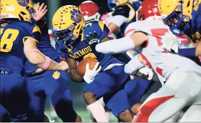  ?? David G. Whitham / For Hearst Connecticu­t Media ?? Seymour RB Caleb Nimo-Sefah gains some tough yards against Wolcott on Friday night.