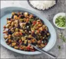  ?? STEVE KLISE — AMERICA’S TEST KITCHEN VIA AP ?? This undated photo provided by America’s Test Kitchen in December 2018 shows Eggplant with Garlic and Basil Sauce in Brookline, Mass. This recipe appears in the book “Cook it in Your Dutch Oven.”