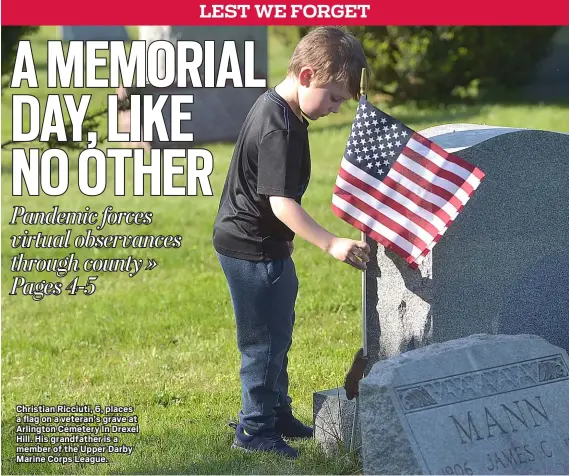  ?? PETE BANNAN - MEDIANEWS GROUP ?? Christian Ricciuti, 6, places a flag on a veteran’s grave at Arlington Cemetery In Drexel Hill. His grandfathe­r is a member of the Upper Darby Marine Corps League.