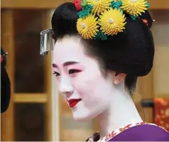  ??  ?? A maiko, or geisha apprentice, in Japan. — AFP