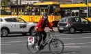  ??  ?? A woman rides her bicycle in Warsaw during a protest by Polish women’s rights activists. Photograph: Wojtek Radwański/ AFP via Getty Images